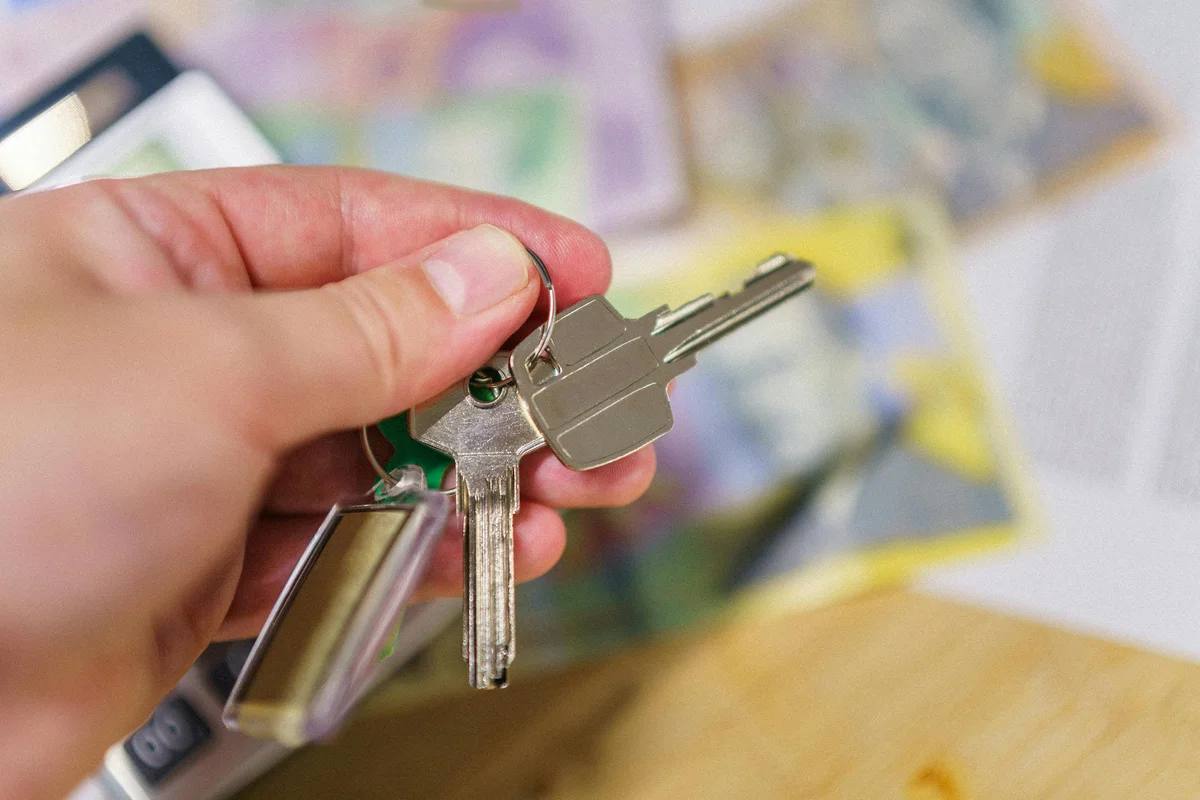 Conveyancing documents and keys on a table